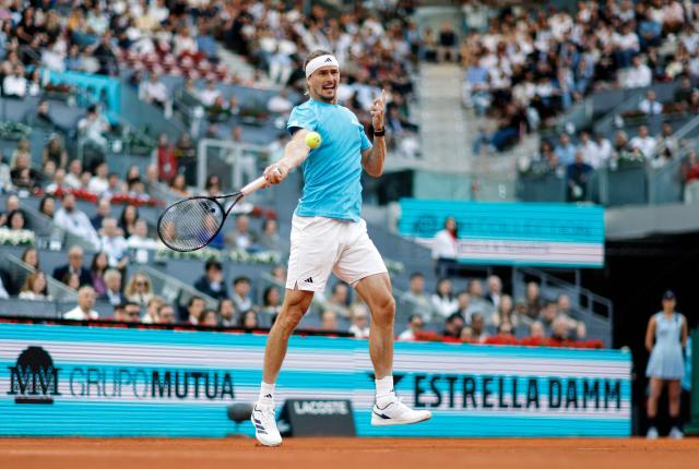 Germany's Alexander Zverev returns the ball to Belgium's Alexander Blockx during their 2026 ATP Tour Madrid Open tennis tournament semi-final singles match at the Caja Magica in Madrid, on May 1, 2026. (Photo by OSCAR DEL POZO / AFP)