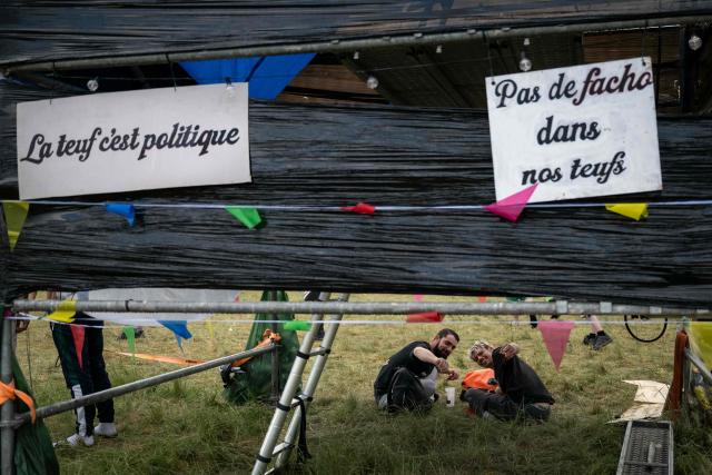 Revellers take part in a Rave Party at a military site in Cornusse, near Bourges, central France on May 1, 2026. Around 20,000 partygoers gathered on May 1, 2026, at a military site near Bourges – described by the authorities as "extremely dangerous" – to take part in a rave party, against a backdrop of tougher legislation targeting these illegal techno gatherings. (Photo by ARNAUD FINISTRE / AFP)