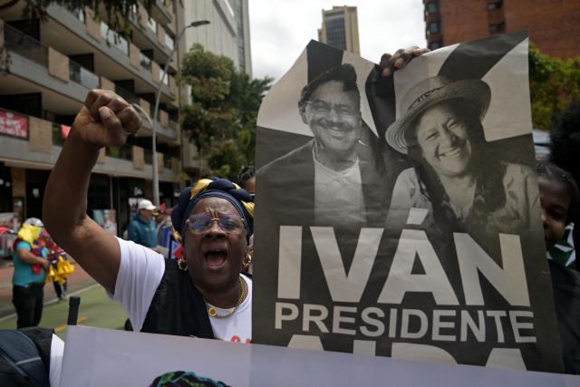 Supporters of Colombia's presidential candidate from the ruling party Pacto Historico, Ivan Cepeda, take part in a May Day rally marking International Workers Day in Bogota on May 1, 2026. (Photo by Raul ARBOLEDA / AFP)
