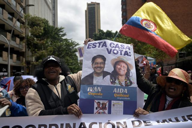 Supporters of Colombia's presidential candidate from the ruling party Pacto Historico, Ivan Cepeda, take part in a May Day rally marking International Workers Day in Bogota on May 1, 2026. (Photo by Raul ARBOLEDA / AFP)