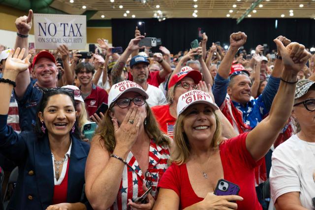 Attendees react as US President Donald Trump arrives to give a speech about taxes and Social Security in The Villages, Florida, on May 1, 2026. (Photo by Jim WATSON / AFP)