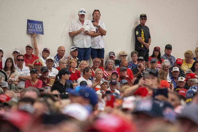 Attendees wait for the arrival of US President Donald Trump to give a speech about taxes and Social Security in The Villages, Florida, on May 1, 2026. (Photo by Jim WATSON / AFP)