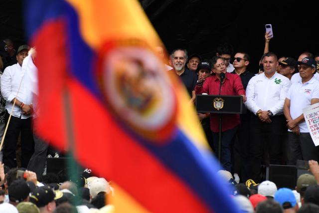 Colombia's President Gustavo Petro (3rd R) delivers a speech during a rally marking International Workers Day in Medellin, Antioquia department, Colombia, on May 1, 2026. (Photo by Jaime SALDARRIAGA / AFP)