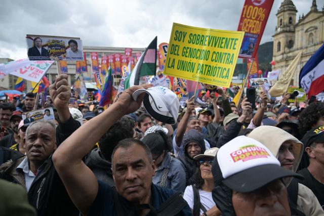Supporters of Colombia's presidential candidate from the ruling party Pacto Historico, Ivan Cepeda, take part in a May Day rally marking International Workers Day in Bogota on May 1, 2026. (Photo by Raul ARBOLEDA / AFP)