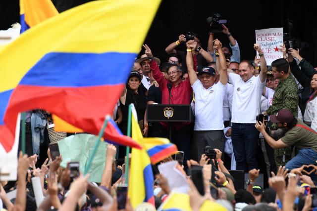 Colombia's President Gustavo Petro (C) waves to supporters during a rally marking International Workers Day in Medellin, Antioquia department, Colombia, on May 1, 2026. (Photo by Jaime SALDARRIAGA / AFP)