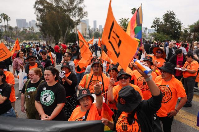 People march during a May Day rally marking International Workers' Day in Los Angeles, California, on May 1, 2026. (Photo by Patrick T. Fallon / AFP)