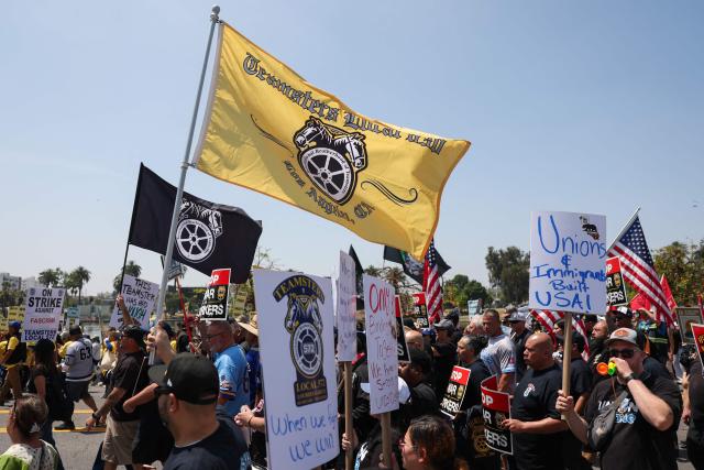 People march during a May Day rally marking International Workers' Day in Los Angeles, California, on May 1, 2026. (Photo by Patrick T. Fallon / AFP)