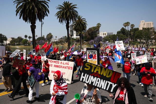 People march during a May Day rally marking International Workers' Day in Los Angeles, California, on May 1, 2026. (Photo by Patrick T. Fallon / AFP)