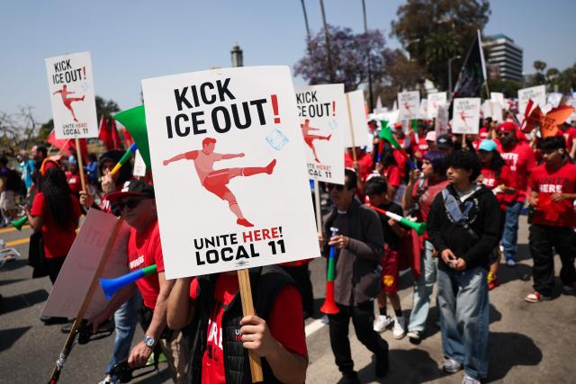 People march during a May Day rally marking International Workers' Day in Los Angeles, California, on May 1, 2026. (Photo by Patrick T. Fallon / AFP)