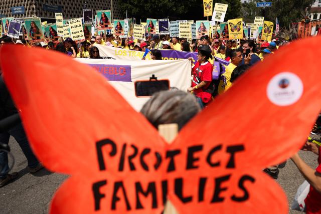 People march during a May Day rally marking International Workers' Day in Los Angeles, California, on May 1, 2026. (Photo by Patrick T. Fallon / AFP)