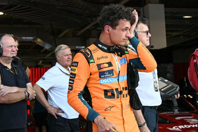 McLaren's British driver Lando Norris exits his car after finishing in the pole position during Sprint qualifying ahead of the 2026 Miami Formula One Grand Prix at Miami International Autodrome in Miami Gardens, Florida, on May 1, 2026. (Photo by CHANDAN KHANNA / AFP)