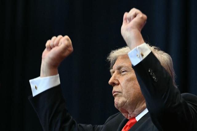 US President Donald Trump does his little dance after giving a speech about taxes and Social Security in The Villages, Florida, on May 1, 2026. (Photo by Jim WATSON / AFP)