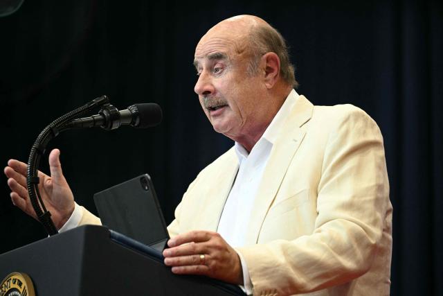 US TV personality Phil McGraw, better known as Dr. Phil, speaks during an event with US President Donald Trump, where he spoke about taxes and Social Security in The Villages, Florida, on May 1, 2026. (Photo by Jim WATSON / AFP)