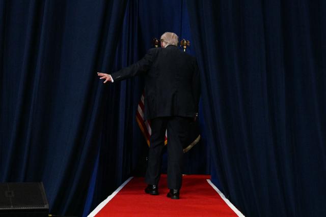 US President Donald Trump walks off the stage after speaking about taxes and Social Security in The Villages, Florida, on May 1, 2026. (Photo by Jim WATSON / AFP)