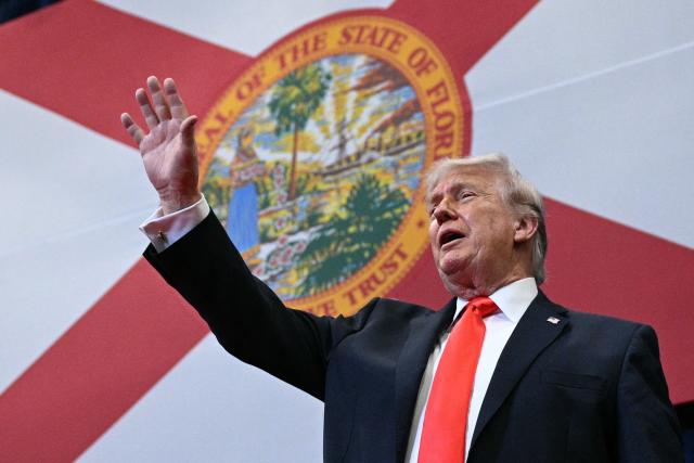 US President Donald Trump cheers supporters after speaking about taxes and Social Security in The Villages, Florida, on May 1, 2026. (Photo by Jim WATSON / AFP)