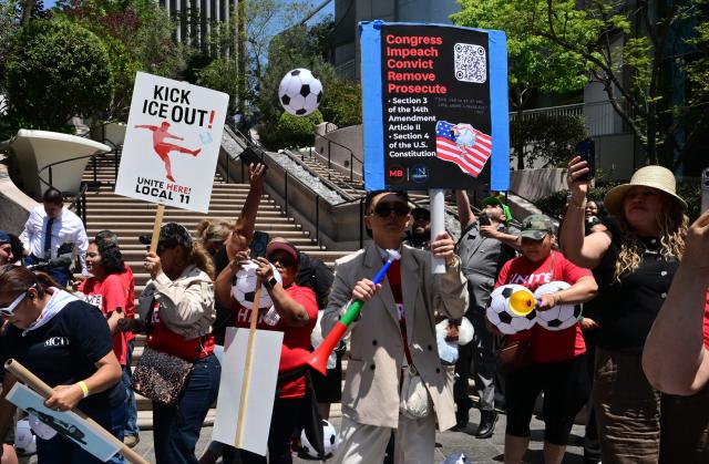 People march during a May Day rally marking International Workers' Day in Los Angeles, on May 1, 2026. (Photo by Frederic J. BROWN / AFP)