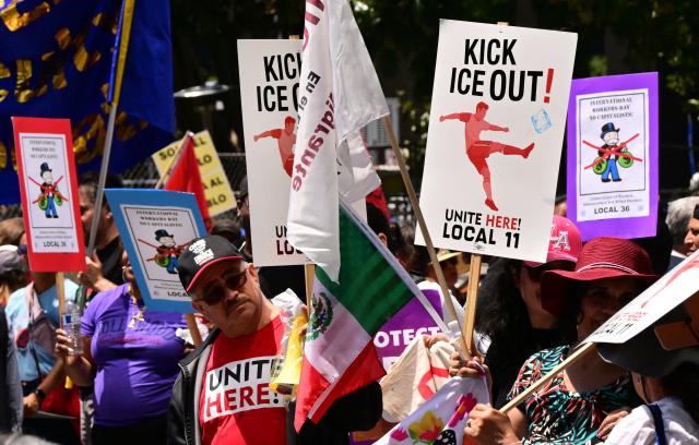 People march during a May Day rally marking International Workers' Day in Los Angeles, on May 1, 2026. (Photo by Frederic J. BROWN / AFP)