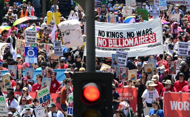 People march during a May Day rally marking International Workers' Day in Los Angeles, on May 1, 2026. (Photo by Frederic J. BROWN / AFP)