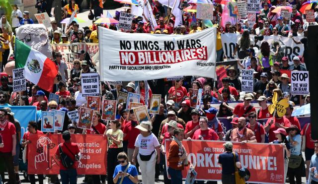 People march during a May Day rally marking International Workers' Day in Los Angeles, on May 1, 2026. (Photo by Frederic J. BROWN / AFP)