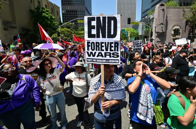 People march during a May Day rally marking International Workers' Day in Los Angeles, on May 1, 2026. (Photo by Frederic J. BROWN / AFP)