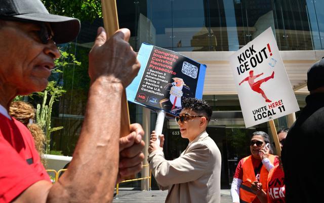 SOFI stadium workers protest outside FIFA World Cup 26 Los Angeles Office calling for ICE to be banned from the World Cup on May 1, 2026. Eight World Cup matches are planned for SOFI stadium during this summer's World Cup. (Photo by Frederic J. BROWN / AFP)