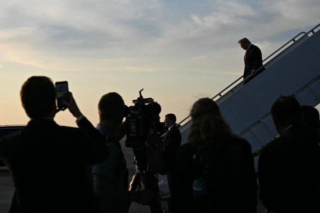 US President Donald Trump steps off Air Force One upon arrival at Palm Beach International Airport, Florida on May 1, 2026. Trump is speaking at an event at The Villages and will later attend the Forum Club of the Palm Beaches dinner. (Photo by Jim WATSON / AFP)