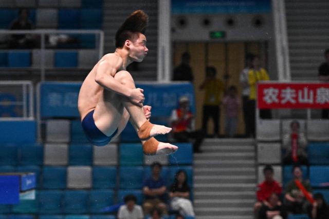 China’s Zheng Jiuyan competes in the men's 3m springboard event at the World Aquatics Diving World Cup Super Finals in Beijing on May 2, 2026. (Photo by Pedro PARDO / AFP)
