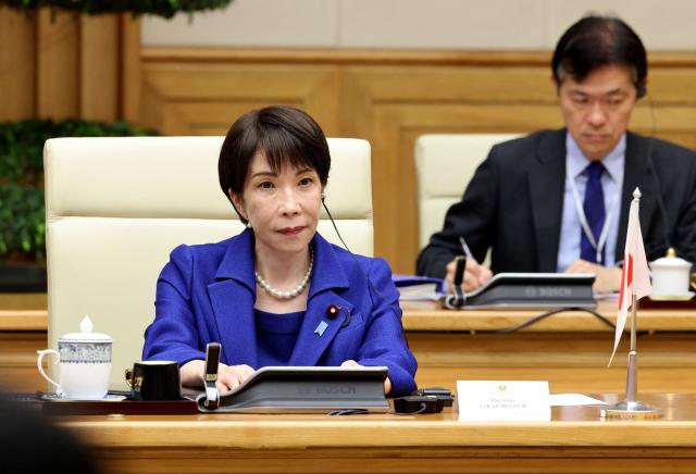 Japan's Prime Minister Sanae Takaichi (L) attends a meeting with Vietnam's Prime Minister Le Minh Hung in Hanoi on May 2, 2026. (Photo by Hoang Long / AFP)