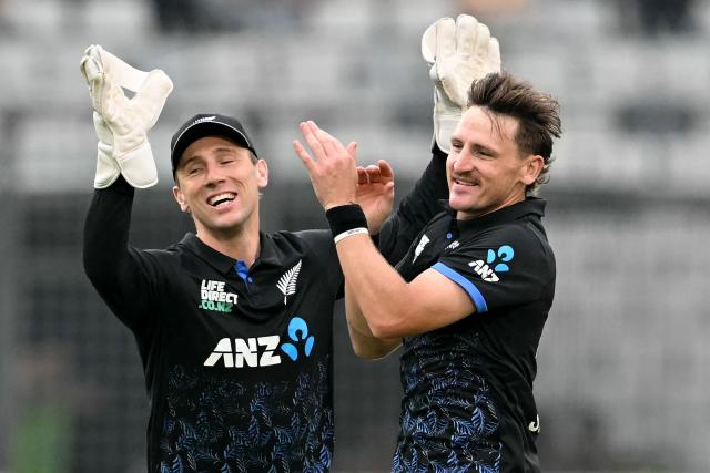 New Zealand's Nathan Smith (R) celebrates with wicketkeeper Dane Cleaver after taking the wicket of Bangladesh's Parvez Hossain Emon during the third T20 cricket match between Bangladesh and New Zealand at the Sher-e-Bangla National Stadium in Mirpur on May 2, 2026. (Photo by Munir UZ ZAMAN / AFP)