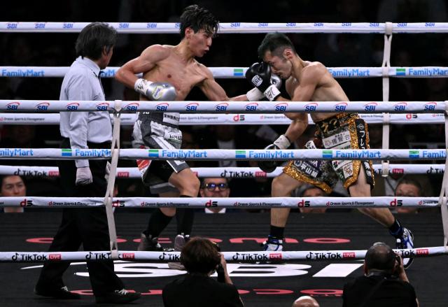 Toshiki Shimomachi (L) fights Reiya Abe in their Featherweight undercard boxing contest at Tokyo Dome in Tokyo on May 2, 2026. (Photo by Yuichi YAMAZAKI / AFP)