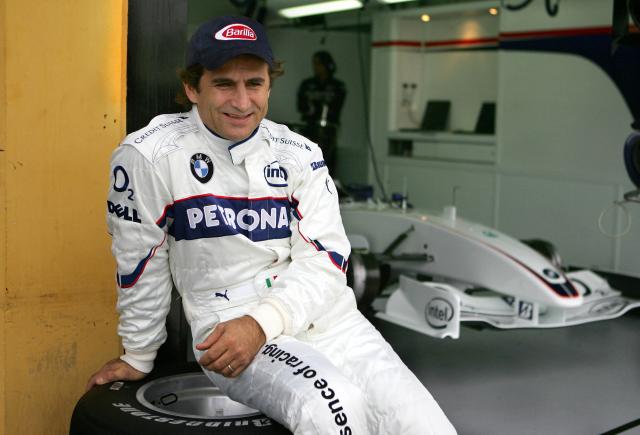 (FILES) Italian F1 driver Alex Zanardi who lost his both legs in an accident 15 September 2001 during a kart championships in Germany gestures after a BMW practice session at the racetrack Ricardo Tormo in Cheste near Valencia 25 November 2006. Alex Zanardi, the Italian racing car driver who became a Paralympic cycling champion after losing both legs in an accident, has died aged 59, his family announced on May 2, 2026. Zanardi, one of his country's most loved and respected sportsmen, who as credited with helping transformed the perception of disability in Italy, died on the evening of May 1. (Photo by Jose Jordan / AFP)