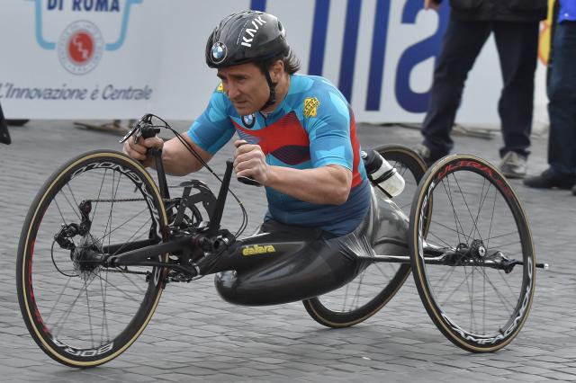 (FILES) Former racing driver and paracyclist, Italian Alex Zanardi takes part in the 23rd Marathon of Rome on April 2, 2017. Alex Zanardi, the Italian racing car driver who became a Paralympic cycling champion after losing both legs in an accident, has died aged 59, his family announced on May 2, 2026. Zanardi, one of his country's most loved and respected sportsmen, who as credited with helping transformed the perception of disability in Italy, died on the evening of May 1. (Photo by Andreas SOLARO / AFP)