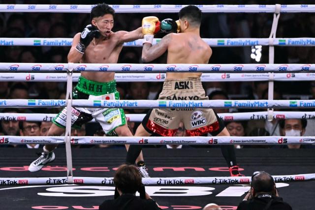 Takuma Inoue (L) fights Kazuto Ioka during their WBC Bantamweight Title Match boxing contest at Tokyo Dome in Tokyo on May 2, 2026. (Photo by Yuichi YAMAZAKI / AFP)