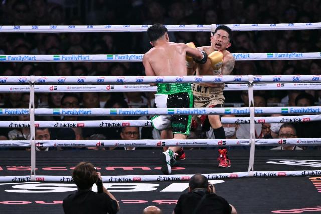 Takuma Inoue (L) fights Kazuto Ioka during their WBC Bantamweight Title Match boxing contest at Tokyo Dome in Tokyo on May 2, 2026. (Photo by Yuichi YAMAZAKI / AFP)
