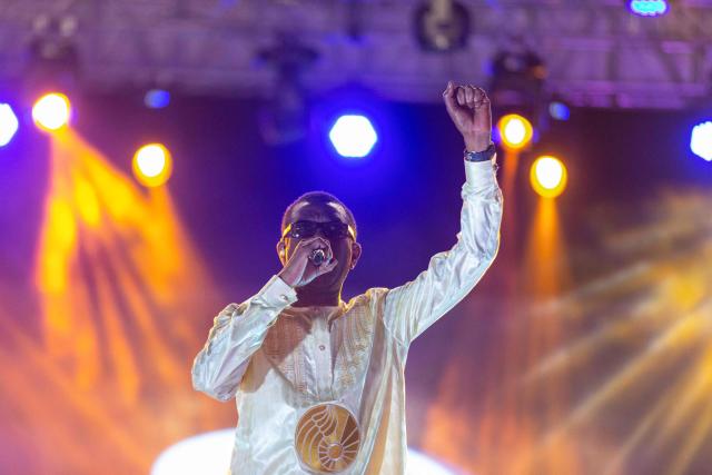 Senegalese singer and artist Youssou N’Dour performs during the 18th Anoumabo Urban Music Festival (FEMUA) in Abidjan on May 1, 2026. (Photo by Chris Boli / AFP)