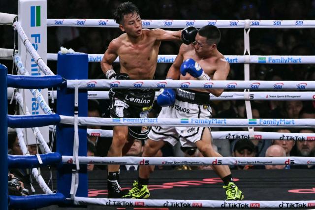 Yoshiki Takei of Japan (L) fights DeKang Wang of China during their super bantamweight non-title boxing contest at Tokyo Dome in Tokyo on May 2, 2026. (Photo by Yuichi YAMAZAKI / AFP)