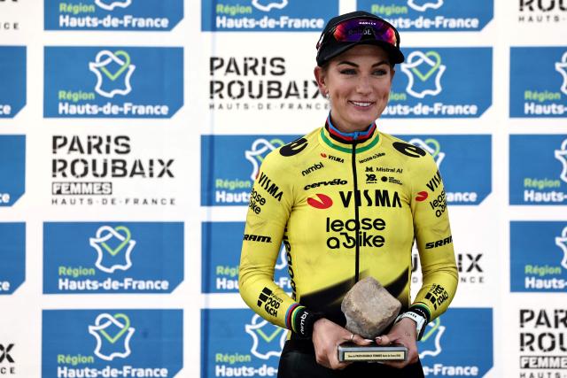 (FILES) Third-placed Team Visma - Lease a Bike's French rider Pauline Ferrand-Prevot celebrates on the podium of the 6th edition of the Women Paris-Roubaix one-day classic cycling race, 143.1 km between Denain and Roubaix, at the Vélodrome André-Pétrieux in Roubaix, northern France, on April 12, 2026. The Womens Vuelta a España starts on May 3, 2026 its toughest edition with a climb to the mythical Angliru, which will test the riders and the great favorite, the French Pauline Ferrand-Prevot, current champion of the Tour de France. (Photo by Anne-Christine POUJOULAT / AFP)