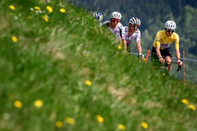 UAE Team Emirates XRG's Slovenian rider Tadej Pogacar, wearing the overall leader's yellow jersey, rides the Jaunpass during the fourth stage of the Tour of Romandie UCI cycling World tour, 149.6 km from Broc and to Charmey, in Jaunpass, Switzerland, on May, 2, 2026. (Photo by Fabrice COFFRINI / AFP)