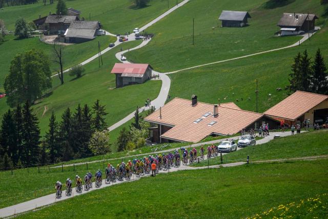 The pack climbs the Jaunpass during the fourth stage of the Tour of Romandie UCI cycling World tour, 149.6 km from Broc and to Charmey, in Jaunpass, Switzerland, on May, 2, 2026. (Photo by Fabrice COFFRINI / AFP)