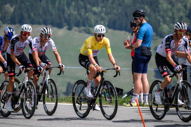 UAE Team Emirates XRG's Slovenian rider Tadej Pogacar, wearing the overall leader's yellow jersey, climbs the Jaunpass during the fourth stage of the Tour of Romandie UCI cycling World tour, 149.6 km from Broc and to Charmey, in Jaunpass, Switzerland, on May, 2, 2026. (Photo by Fabrice COFFRINI / AFP)