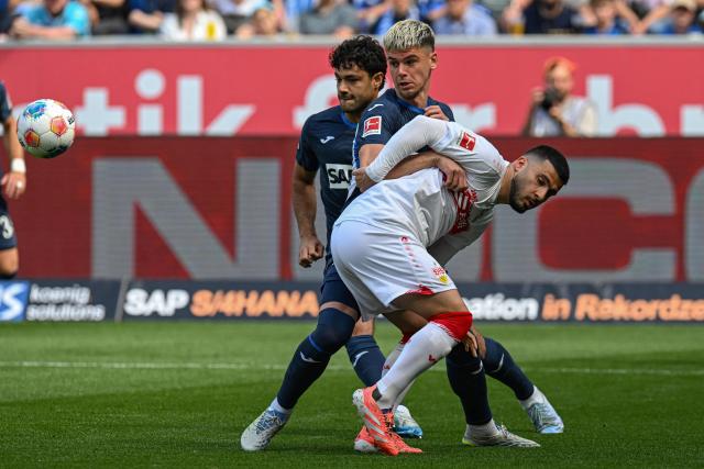 Stuttgart's German forward #26 Deniz Undav (Front) and Hoffenheim's Kosovar-Swiss defender #21 Albian Hajdari vie for the ball during the German first division Bundesliga football match between TSG Hoffenheim and VfB Stuttgart in Sinsheim, on May 2, 2026. (Photo by THOMAS KIENZLE / AFP) / DFL REGULATIONS PROHIBIT ANY USE OF PHOTOGRAPHS AS IMAGE SEQUENCES AND/OR QUASI-VIDEO