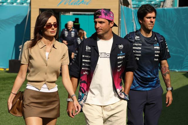 Williams' Spanish driver Carlos Sainz and British model Rebecca Donaldson arrive for the 2026 Miami Formula One Sprint at Miami International Autodrome in Miami Gardens, Florida, on May 2, 2026. (Photo by CHARLY TRIBALLEAU / AFP)