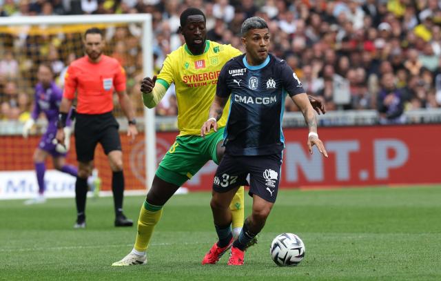 Nantes' Malian midfielder #28 Ibrahima Sissoko fights for the ball with Marseille's Argentinian defender #32 Facundo Medina during the French L1 football match between FC Nantes and Olympique de Marseille at the Stade de la Beaujoire–Louis Fonteneau in Nantes, western France on May 2, 2026. (Photo by Fred TANNEAU / AFP)