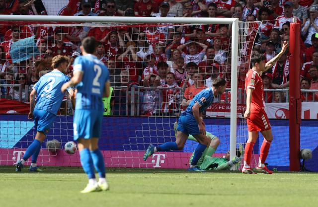 Heidenheim's Georgian forward #11 Budu Zivzivadze (2R) celebrates scoring the opening goal during the German first division Bundesliga football match between FC Bayern Munich and Heidenheim in Munich on May 2, 2026. (Photo by Alexandra BEIER / AFP) / DFL REGULATIONS PROHIBIT ANY USE OF PHOTOGRAPHS AS IMAGE SEQUENCES AND/OR QUASI-VIDEO