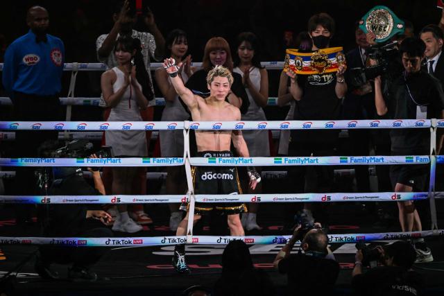 Naoya Inoue (C) celebrates after defeating Junto Nakatani in their super bantamweight championship boxing contest at Tokyo Dome in Tokyo on May 2, 2026. (Photo by Yuichi YAMAZAKI / AFP)