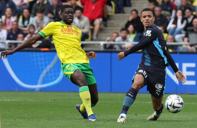 Nantes' French midfielder #21 Mohamed Kaba (L) fights for the ball with Marseille's English forward #10 Mason Greenwood during the French L1 football match between FC Nantes and Olympique de Marseille at the Stade de la Beaujoire–Louis Fonteneau in Nantes, western France on May 2, 2026. (Photo by Fred TANNEAU / AFP)