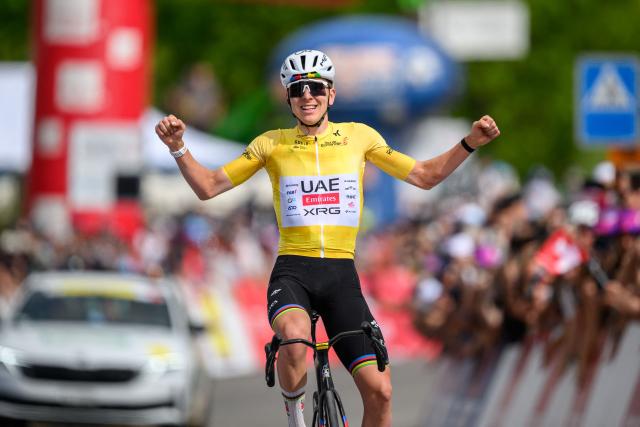 UAE Team Emirates-XRG's Slovenian rider Tadej Pogacar celebrates as he crosses the finish line wining the fourth stage of the Tour of Romandie UCI cycling World tour, 149.6 km from Broc and to Charmey, in Charmey, Switzerland, on May, 2, 2026. (Photo by Fabrice COFFRINI / AFP)