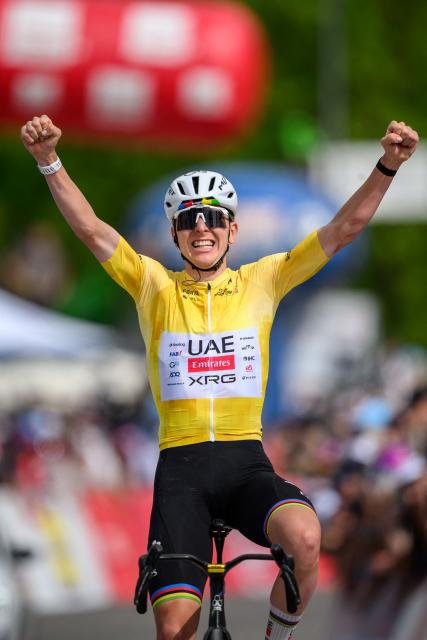 UAE Team Emirates-XRG's Slovenian rider Tadej Pogacar celebrates as he crosses the finish line wining the fourth stage of the Tour of Romandie UCI cycling World tour, 149.6 km from Broc and to Charmey, in Charmey, Switzerland, on May, 2, 2026. (Photo by Fabrice COFFRINI / AFP)