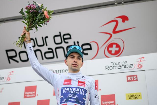 Bahrain Victorious’ French rider Lenny Martinez wearing the best young rider's white jersey reacts during the podium ceremony after the fourth stage of the Tour of Romandie UCI cycling World tour, 149.6 km from Broc and to Charmey, in Charmey, Switzerland, on May, 2, 2026. (Photo by Fabrice COFFRINI / AFP)