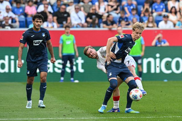 Stuttgart's German defender #07 Maximilian Mittelstaedt (R Back) and Hoffenheim's German forward #33 Max Moerstedt (R Front) vie for the ball during the German first division Bundesliga football match between TSG Hoffenheim and VfB Stuttgart in Sinsheim, on May 2, 2026. (Photo by THOMAS KIENZLE / AFP) / DFL REGULATIONS PROHIBIT ANY USE OF PHOTOGRAPHS AS IMAGE SEQUENCES AND/OR QUASI-VIDEO